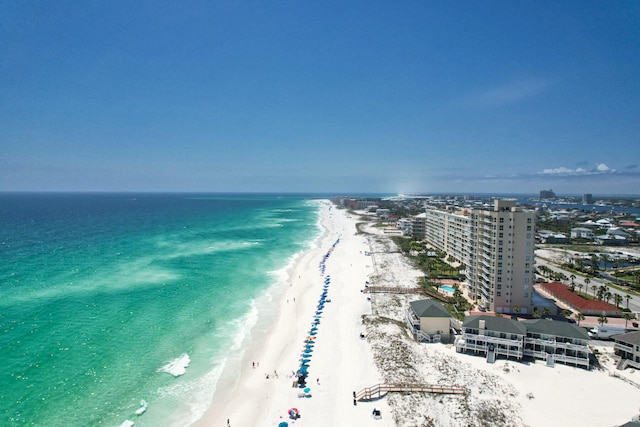 bird's eye view featuring a water view and a view of the beach