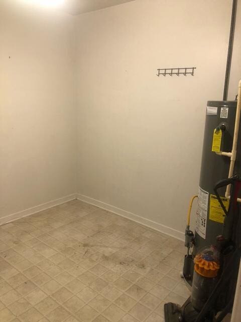 utility room featuring water heater