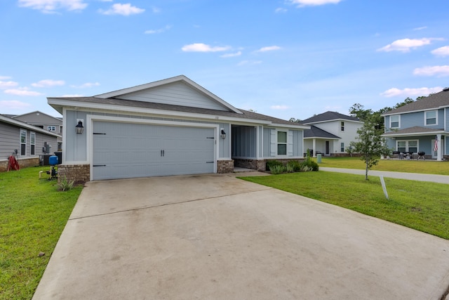 view of front of property with a garage and a front yard