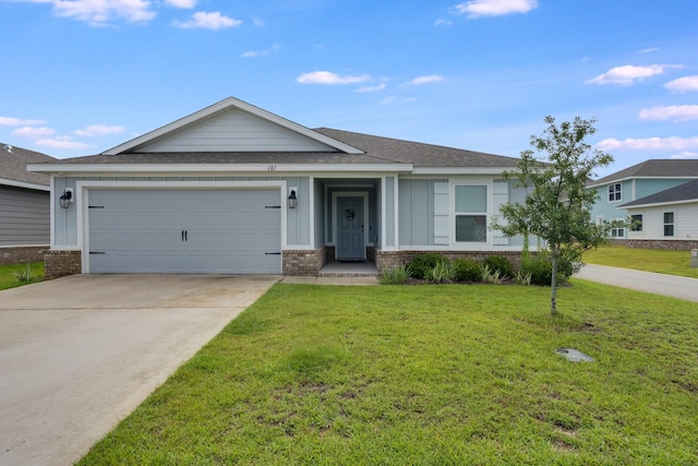 ranch-style home with a garage and a front yard