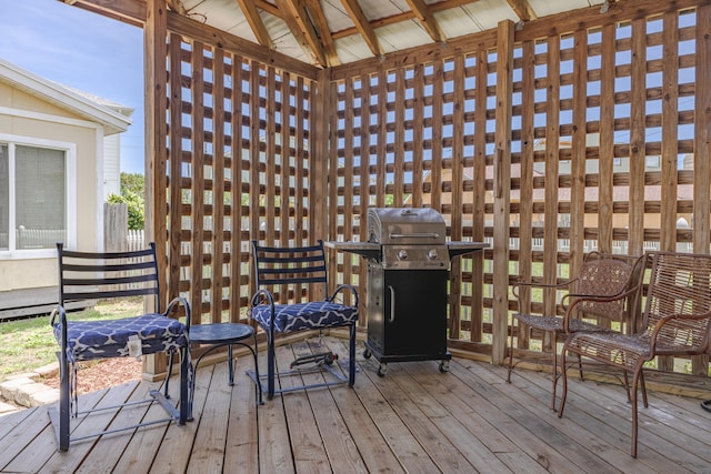 wooden terrace with area for grilling