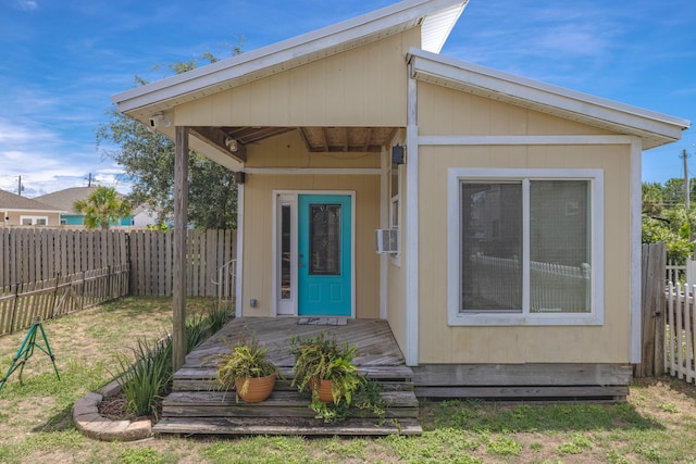 entrance to property with a yard