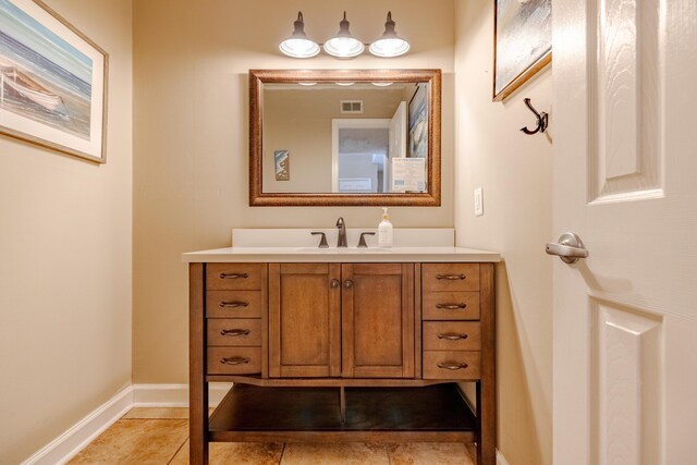 bathroom featuring tile patterned floors and vanity