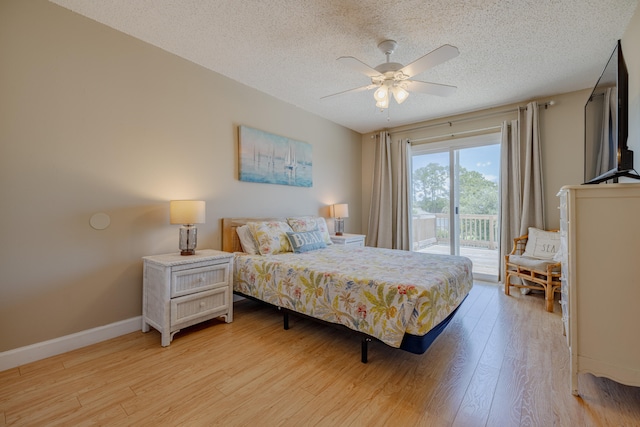 bedroom with access to exterior, a textured ceiling, ceiling fan, and light hardwood / wood-style floors