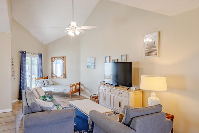 living room featuring light tile patterned floors, high vaulted ceiling, and ceiling fan