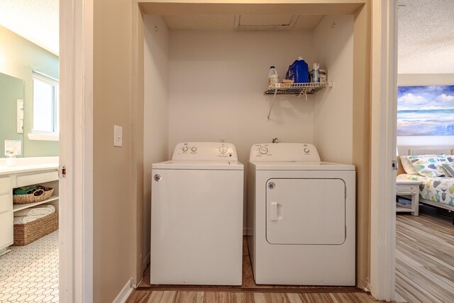 laundry room featuring separate washer and dryer