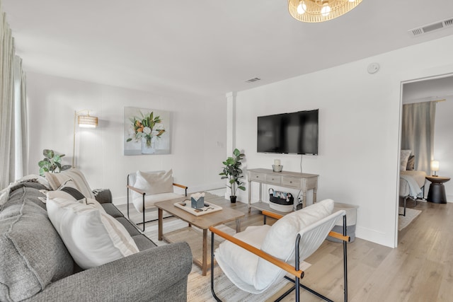 living room with light hardwood / wood-style flooring