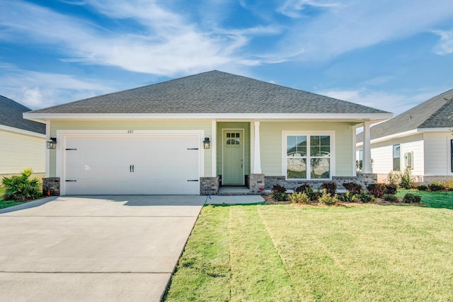 view of front facade featuring a garage and a front yard