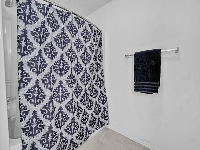 bathroom with tile patterned floors