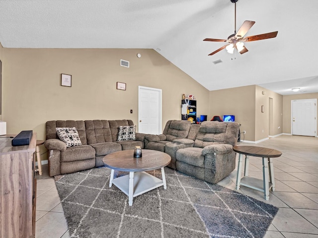 tiled living room featuring high vaulted ceiling and ceiling fan