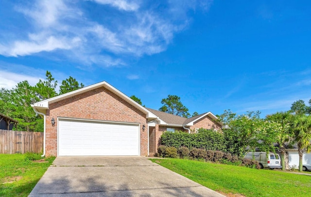 ranch-style house featuring a garage and a front lawn