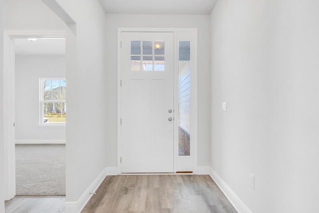 entryway with light hardwood / wood-style flooring