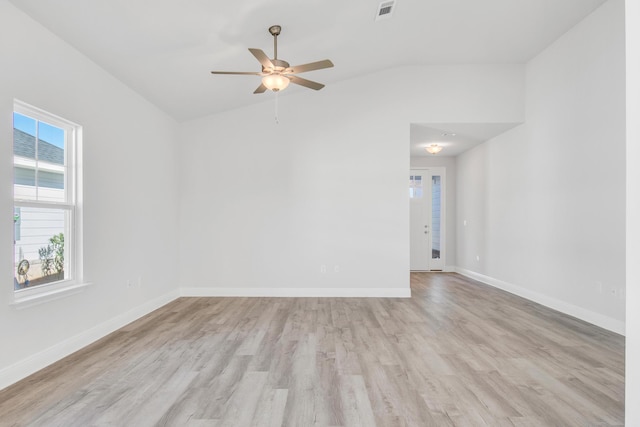 empty room featuring vaulted ceiling, ceiling fan, and light hardwood / wood-style flooring