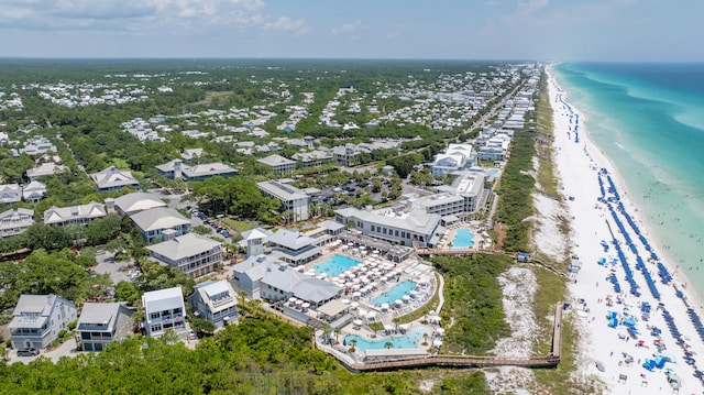 birds eye view of property with a water view and a view of the beach