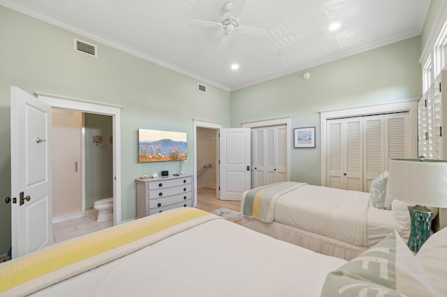 tiled bedroom with multiple closets, ceiling fan, connected bathroom, and ornamental molding