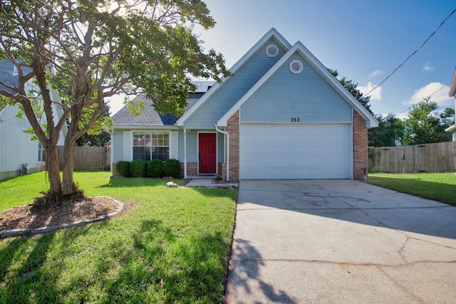 view of front of property with a garage and a front yard