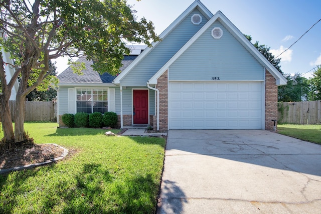 view of front facade featuring a garage and a front yard