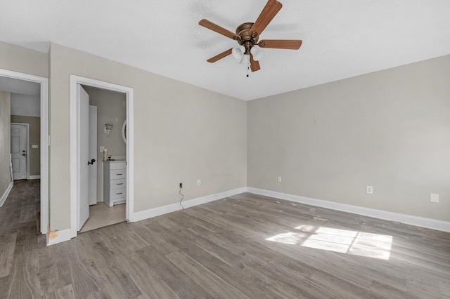 unfurnished bedroom featuring ceiling fan, wood finished floors, and baseboards