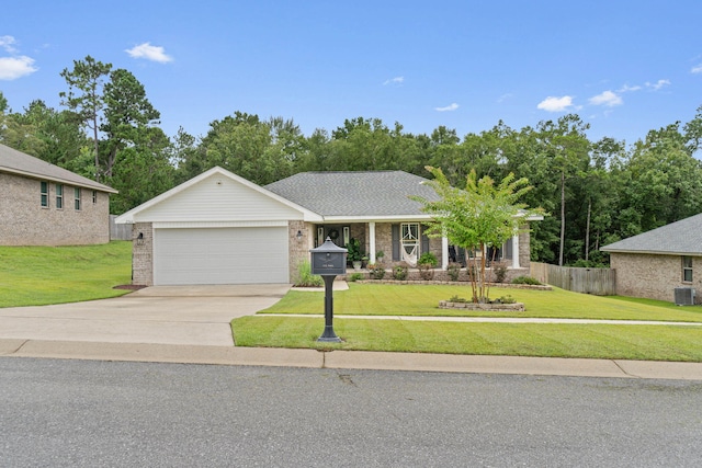 view of front of home with a front lawn and a garage