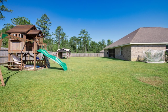6537 Torrey Pnes, Laurel Hill, FL 32567 - view of yard with a fenced backyard and a playground