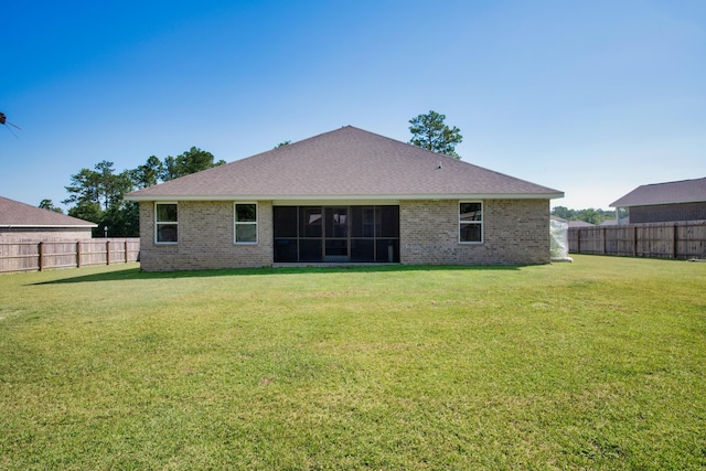6537 Torrey Pnes, Laurel Hill, FL 32567 - back of house featuring a lawn, brick siding, and a fenced backyard