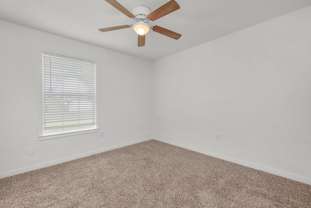 unfurnished room with carpet and ceiling fan