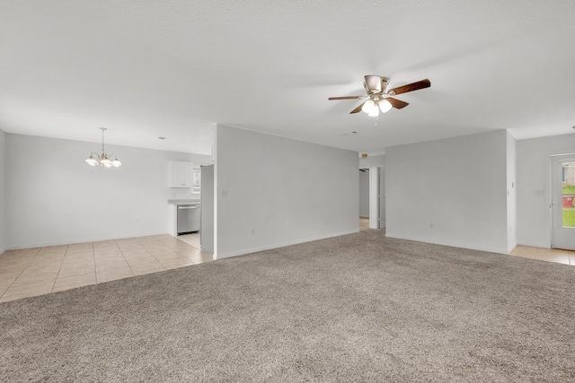 unfurnished living room with ceiling fan with notable chandelier and light carpet