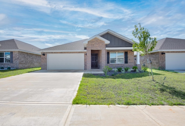 view of front facade with a garage and a front yard