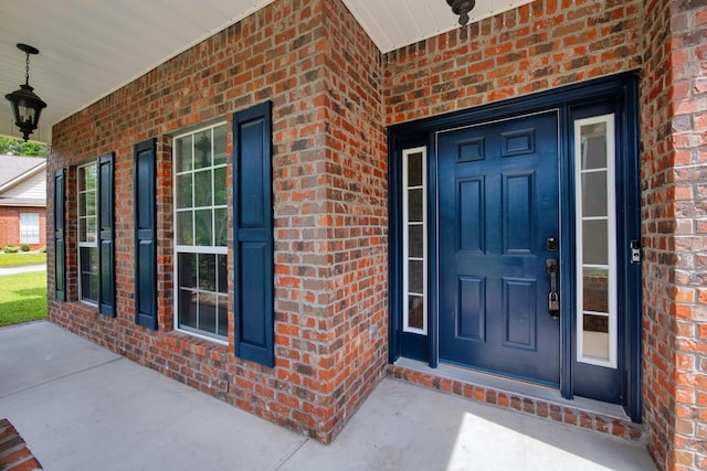 property entrance featuring a porch