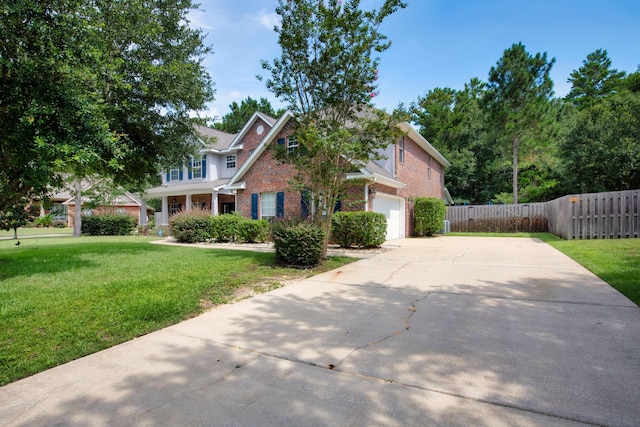 view of front of home featuring a garage and a front yard