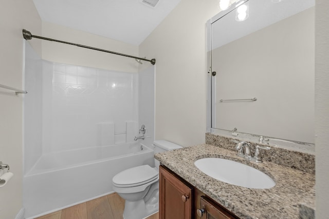 full bathroom featuring visible vents, toilet, shower / bathtub combination, wood finished floors, and vanity