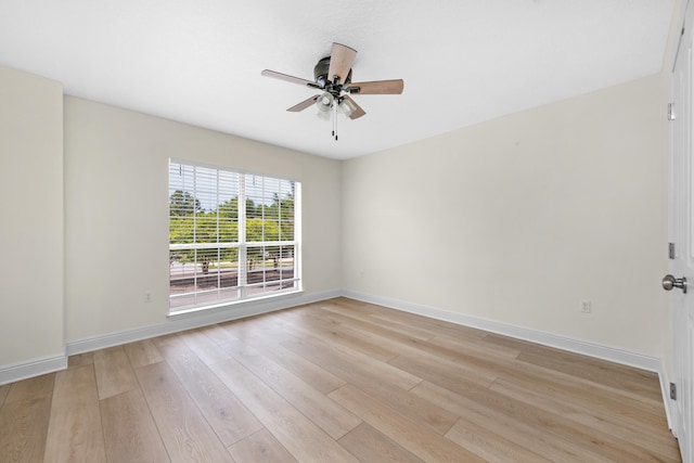 spare room with light hardwood / wood-style floors and ceiling fan