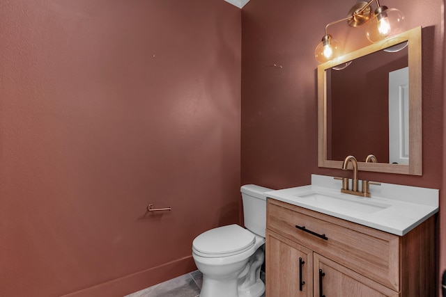 bathroom featuring vanity, toilet, and tile patterned floors