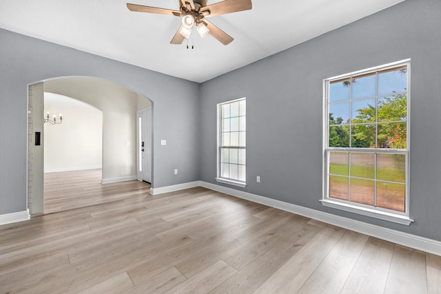 empty room with light hardwood / wood-style floors and ceiling fan