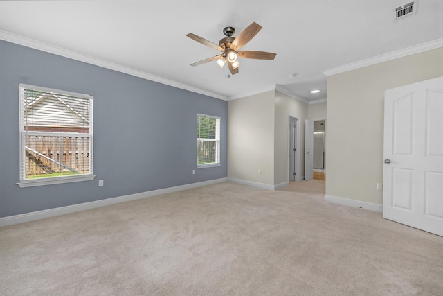 unfurnished bedroom with light carpet, multiple windows, ceiling fan, and crown molding