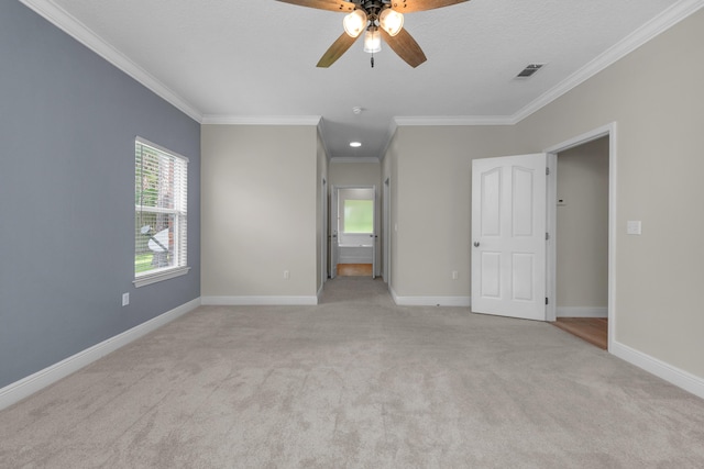 interior space featuring light carpet, a healthy amount of sunlight, visible vents, and baseboards