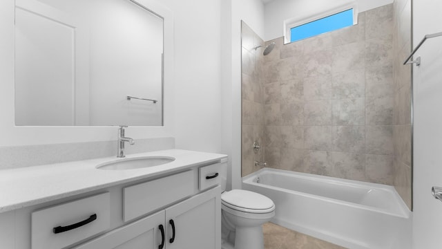 full bathroom with tile patterned flooring, toilet, vanity, and tiled shower / bath