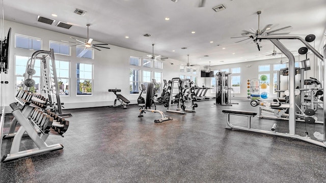 workout area with ceiling fan and a healthy amount of sunlight