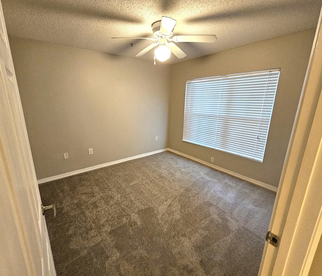 empty room with carpet floors, a textured ceiling, and ceiling fan