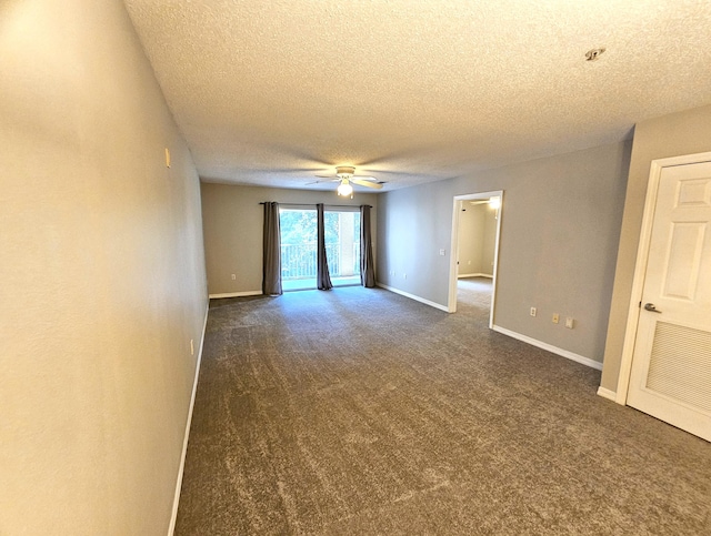 empty room featuring a textured ceiling, ceiling fan, and dark carpet