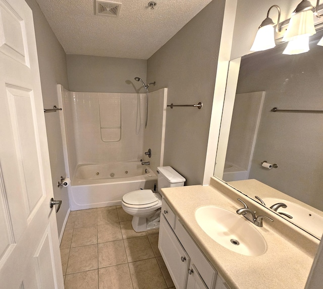 full bathroom with a textured ceiling, tile patterned floors, vanity, toilet, and  shower combination