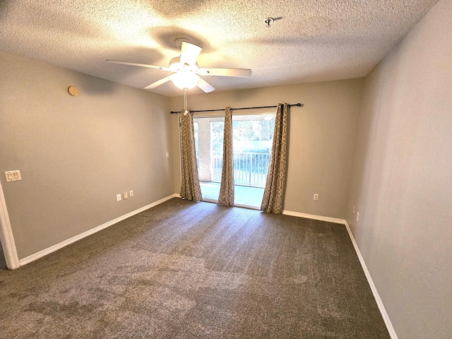 carpeted spare room with a textured ceiling and ceiling fan