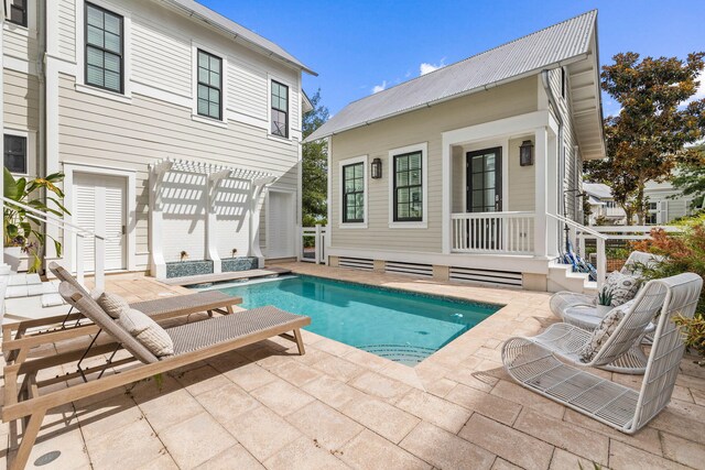 view of swimming pool featuring a pergola and a patio area