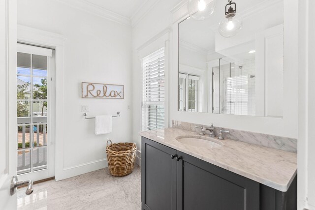 bathroom with vanity, tile patterned floors, and crown molding