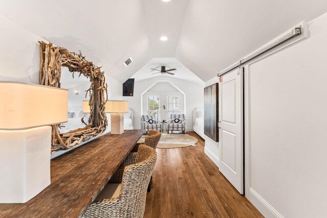 interior space featuring lofted ceiling, ceiling fan, and hardwood / wood-style floors