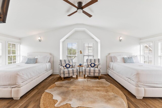 bedroom with dark wood-type flooring, ceiling fan, and vaulted ceiling