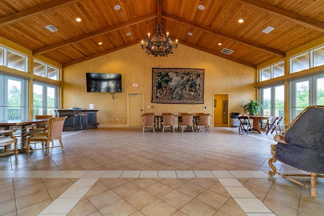 living room with wood ceiling, beamed ceiling, high vaulted ceiling, and a chandelier