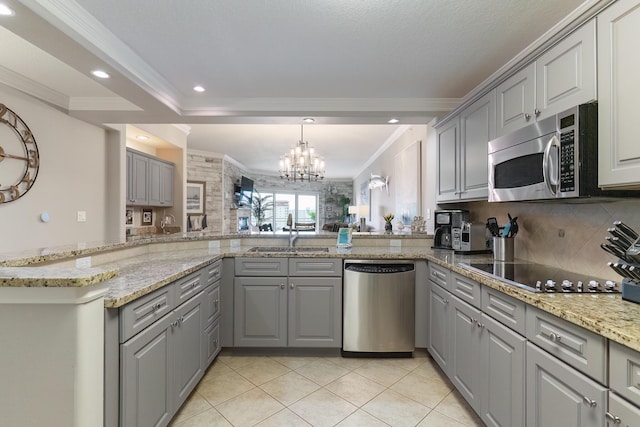 kitchen with sink, gray cabinets, kitchen peninsula, and appliances with stainless steel finishes