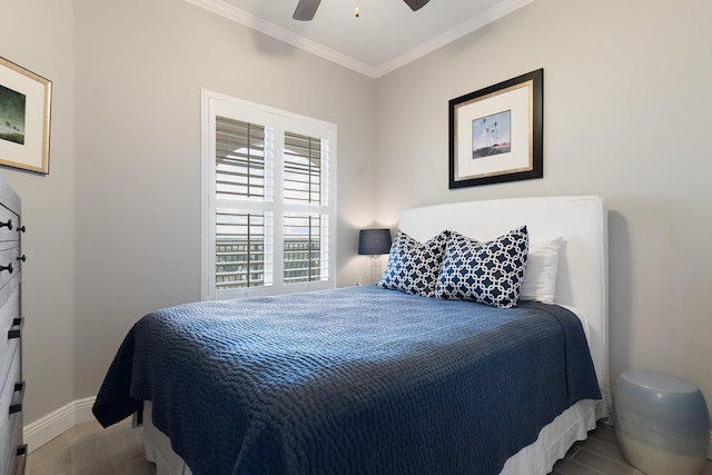 bedroom with crown molding, light wood-type flooring, and ceiling fan