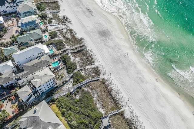 drone / aerial view featuring a view of the beach and a water view